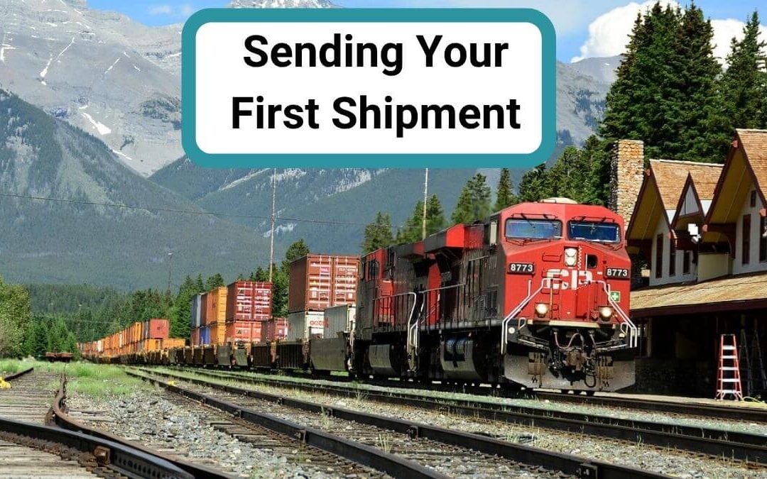 Freight train carrying shipping containers through mountains representing first shipment process and logistics challenges